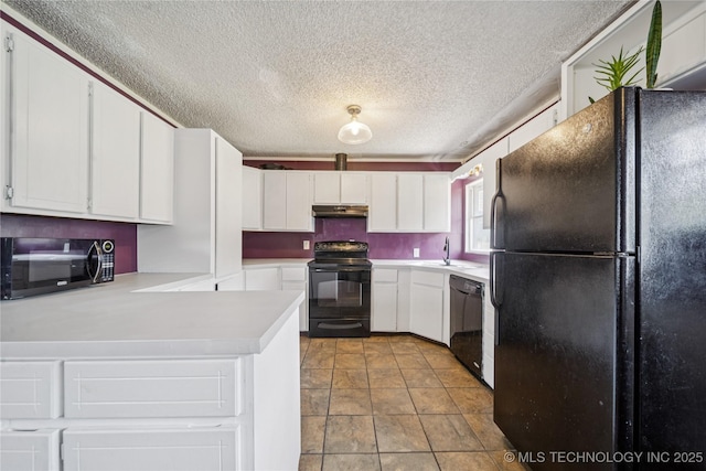 9025 N 156th Rd, Beggs, OK 74421 - kitchen with black appliances, a textured ceiling, light countertops, under cabinet range hood, and white cabinetry