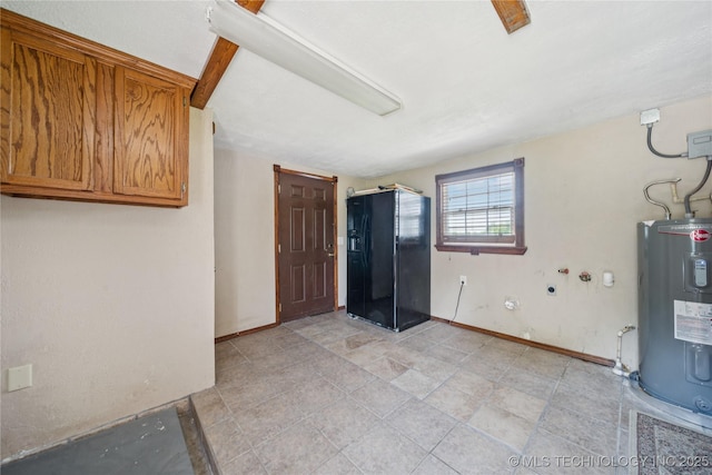 9025 N 156th Rd, Beggs, OK 74421 - basement featuring electric water heater and black fridge with ice dispenser