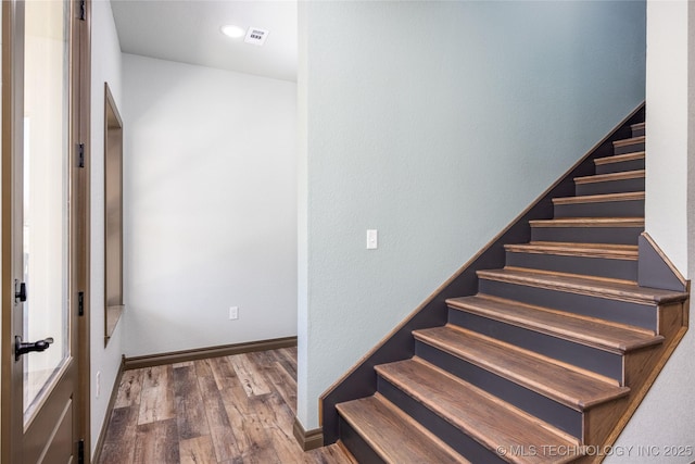 101 Dunn, Caddo, OK 74729 - stairway with wood finished floors and baseboards