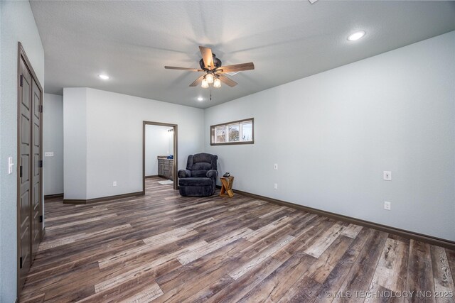 101 Dunn, Caddo, OK 74729 - sitting room featuring wood finished floors, a ceiling fan, and recessed lighting