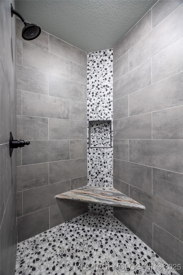 101 Dunn, Caddo, OK 74729 - full bath with tiled shower and a textured ceiling