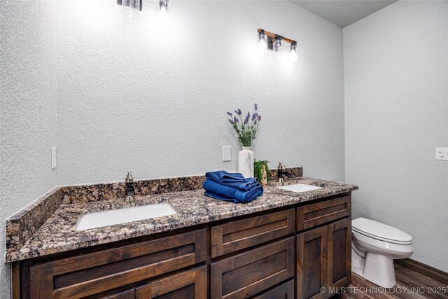 101 Dunn, Caddo, OK 74729 - full bath with double vanity and wood finished floors