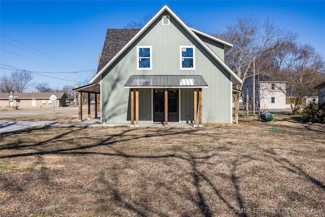 101 Dunn, Caddo, OK 74729 - rear view of property with a metal roof, a standing seam roof, and a shingled roof