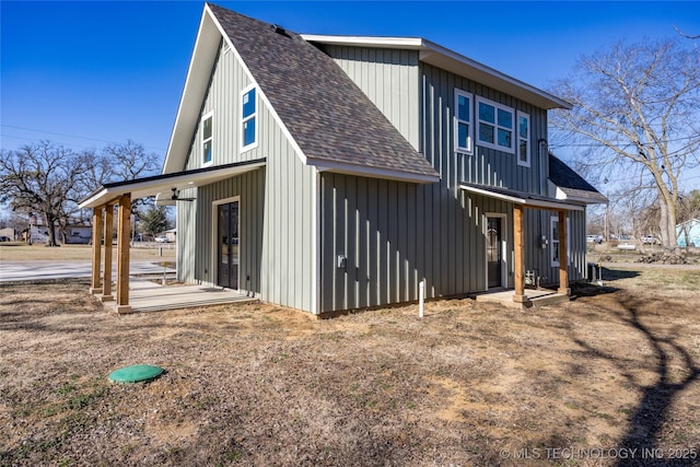 101 Dunn, Caddo, OK 74729 - rear view of house featuring roof with shingles and board and batten siding