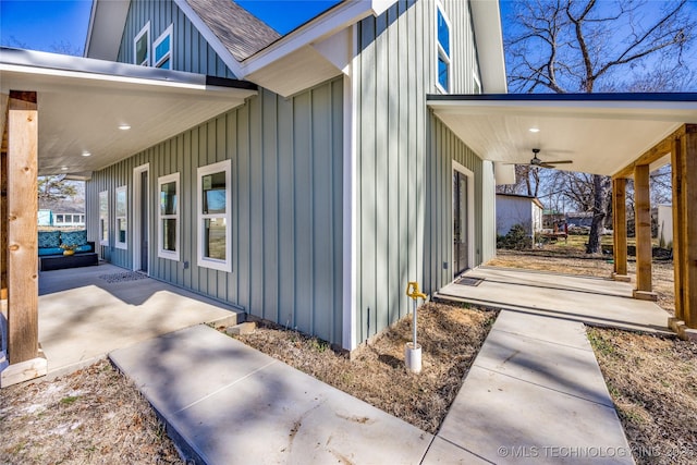 101 Dunn, Caddo, OK 74729 - view of property exterior with board and batten siding, ceiling fan, and a shingled roof