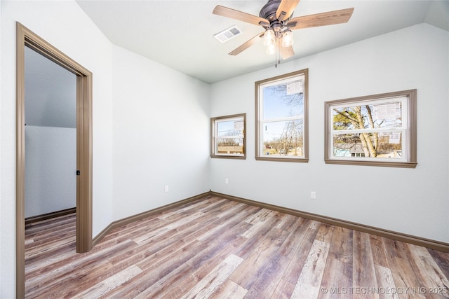 101 Dunn, Caddo, OK 74729 - empty room featuring light wood finished floors, ceiling fan, and lofted ceiling