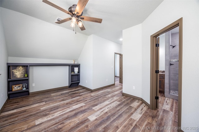 101 Dunn, Caddo, OK 74729 - additional living space featuring wood finished floors, ceiling fan, and lofted ceiling
