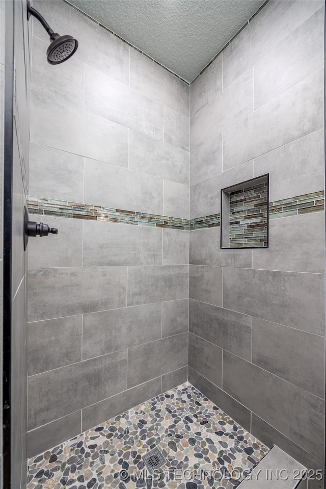 101 Dunn, Caddo, OK 74729 - full bathroom featuring tiled shower and a textured ceiling