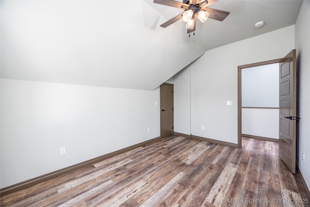 101 Dunn, Caddo, OK 74729 - additional living space featuring wood finished floors, a ceiling fan, and vaulted ceiling