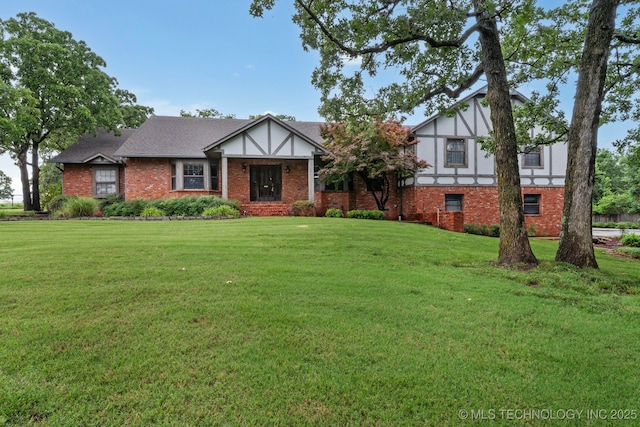 11637 W 86th St S, Sapulpa, OK 74066 - tudor-style house with brick siding and a front yard