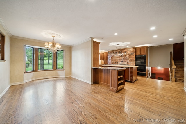 11637 W 86th St S, Sapulpa, OK 74066 - kitchen featuring a chandelier, open shelves, brown cabinetry, crown molding, and light wood-style floors