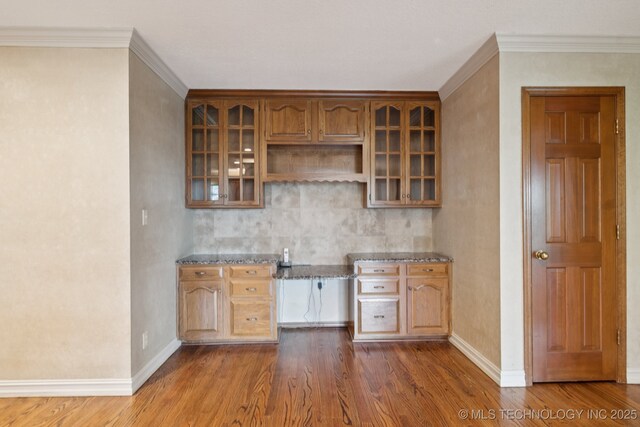 11637 W 86th St S, Sapulpa, OK 74066 - kitchen with dark wood-type flooring, stone counters, glass insert cabinets, ornamental molding, and open shelves