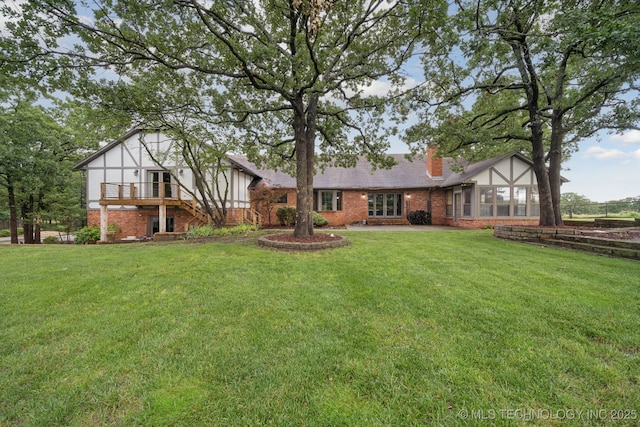 11637 W 86th St S, Sapulpa, OK 74066 - view of front facade with brick siding, a front lawn, and a chimney