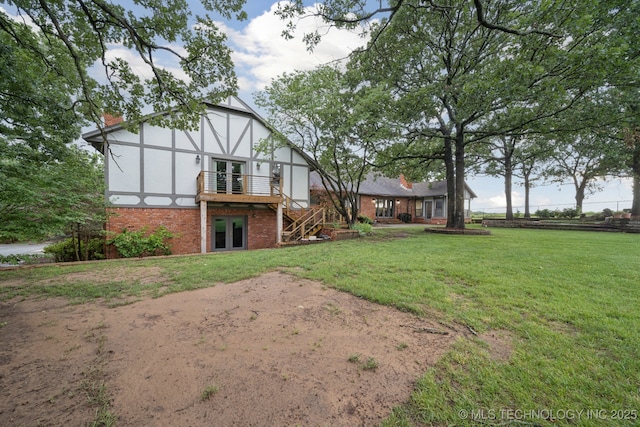 11637 W 86th St S, Sapulpa, OK 74066 - rear view of house featuring brick siding, a chimney, a lawn, a wooden deck, and stairs