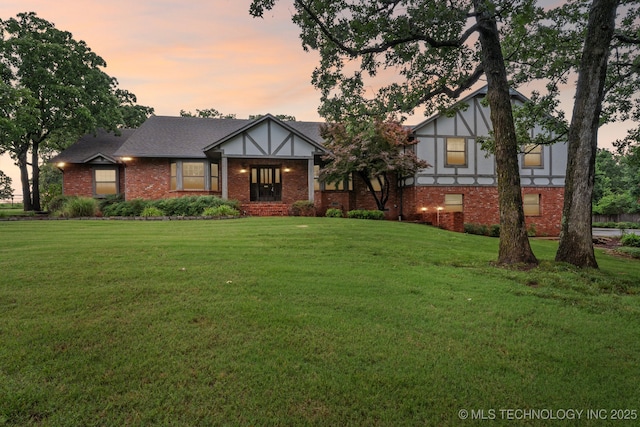 11637 W 86th St S, Sapulpa, OK 74066 - tudor house with brick siding and a yard