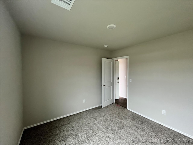 3118 SE Talimena Ct, Bartlesville, OK 74006 - unfurnished room featuring dark colored carpet and baseboards