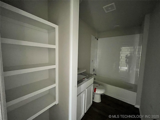 3118 SE Talimena Ct, Bartlesville, OK 74006 - full bath with vanity, shower / bathtub combination, and wood finished floors