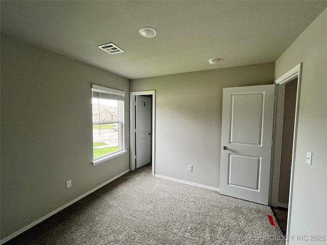 3118 SE Talimena Ct, Bartlesville, OK 74006 - unfurnished bedroom with baseboards and carpet floors