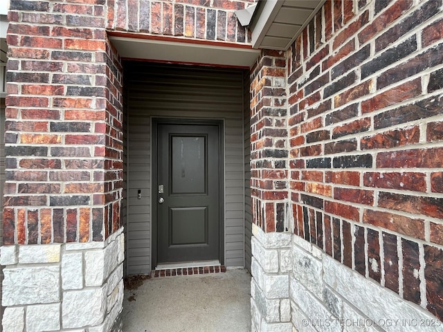 3118 SE Talimena Ct, Bartlesville, OK 74006 - property entrance with brick siding