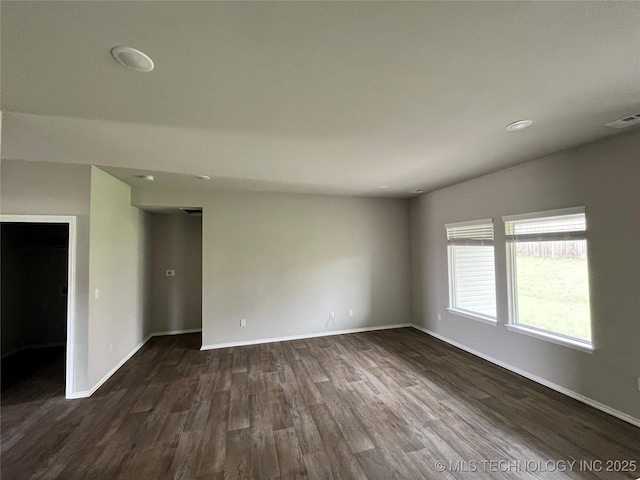 3118 SE Talimena Ct, Bartlesville, OK 74006 - empty room with dark wood finished floors and recessed lighting