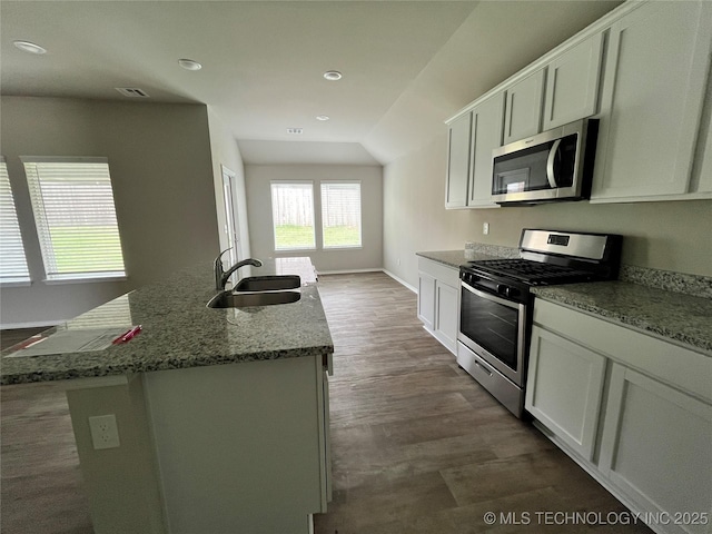 3118 SE Talimena Ct, Bartlesville, OK 74006 - kitchen featuring stainless steel appliances, recessed lighting, stone counters, a center island with sink, and white cabinetry