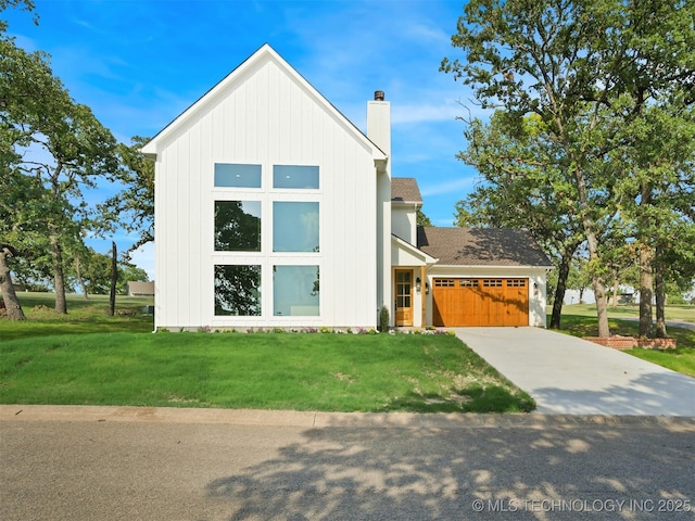 2 Valley View Dr, Burneyville, OK 73430 - view of front of house with a chimney, a garage, a front yard, and concrete driveway