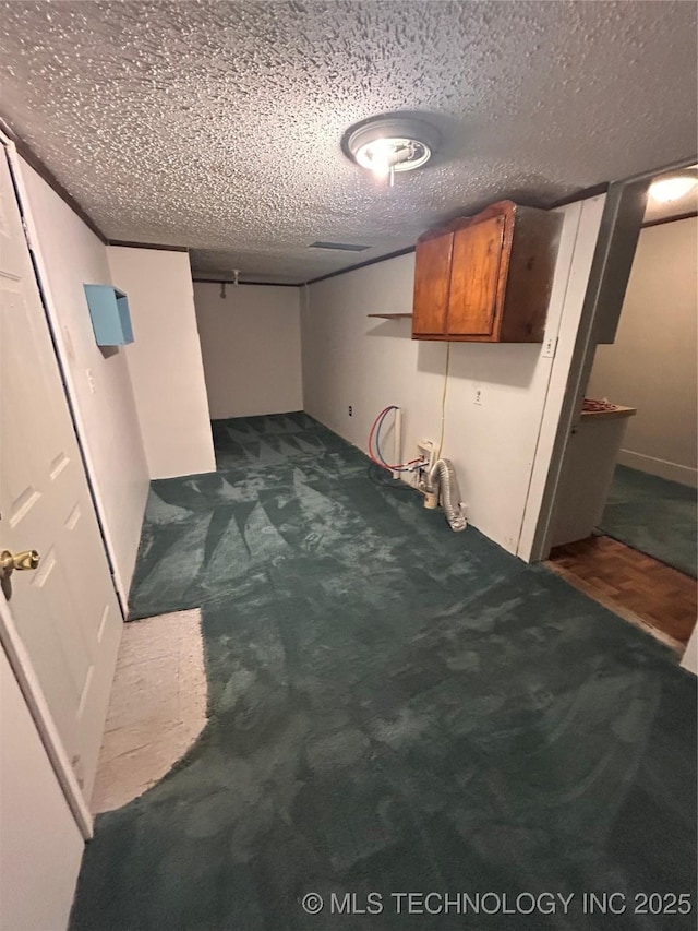 1315 W 5th St, Okmulgee, OK 74447 - finished basement with a textured ceiling and dark carpet