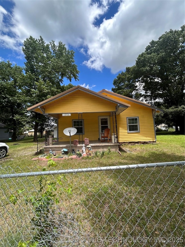1315 W 5th St, Okmulgee, OK 74447 - bungalow-style house with a porch