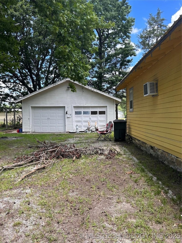 1315 W 5th St, Okmulgee, OK 74447 - detached garage with a wall unit AC
