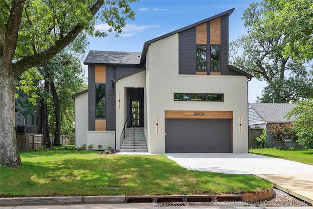 3008 S Boston Ct, Tulsa, OK 74114 - modern home featuring brick siding, a garage, and concrete driveway