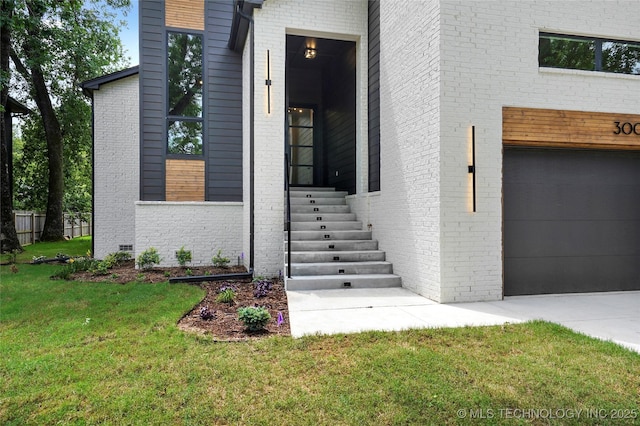 3008 S Boston Ct, Tulsa, OK 74114 - entrance to property with a yard, brick siding, and an attached garage