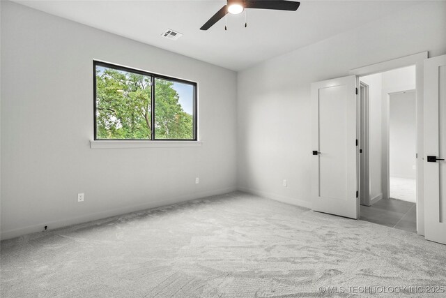 3008 S Boston Ct, Tulsa, OK 74114 - unfurnished bedroom with carpet floors and a ceiling fan