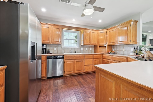 23535 E 720th Rd, Wagoner, OK 74467 - kitchen with stainless steel appliances, light countertops, dark wood-type flooring, backsplash, and recessed lighting