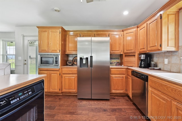23535 E 720th Rd, Wagoner, OK 74467 - kitchen with stainless steel appliances, light countertops, tasteful backsplash, dark wood-style flooring, and recessed lighting