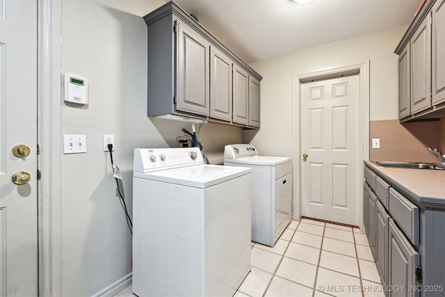 23535 E 720th Rd, Wagoner, OK 74467 - washroom with cabinet space, washing machine and clothes dryer, and light tile patterned floors