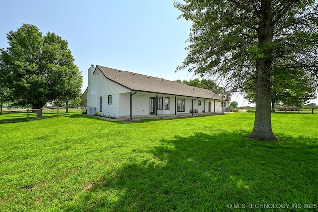 23535 E 720th Rd, Wagoner, OK 74467 - rear view of house featuring a chimney