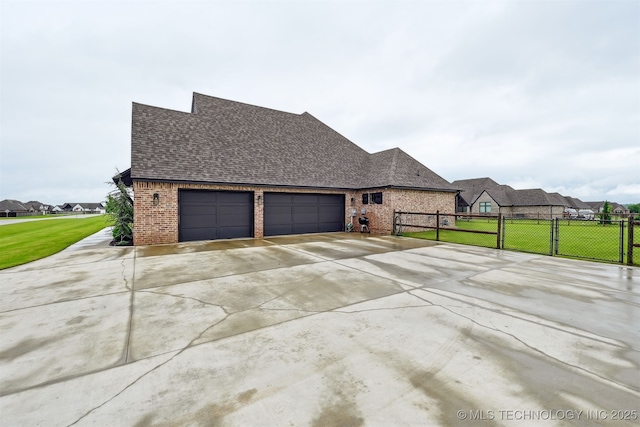 11325 S 212th E Ave, Broken Arrow, OK 74014 - view of side of property with brick siding, a garage, concrete driveway, roof with shingles, and a gate
