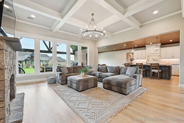 11325 S 212th E Ave, Broken Arrow, OK 74014 - living room with light wood-style floors, a chandelier, beam ceiling, coffered ceiling, and recessed lighting