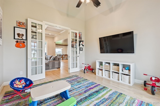 11325 S 212th E Ave, Broken Arrow, OK 74014 - recreation room with french doors, a ceiling fan, wood finished floors, and a high ceiling
