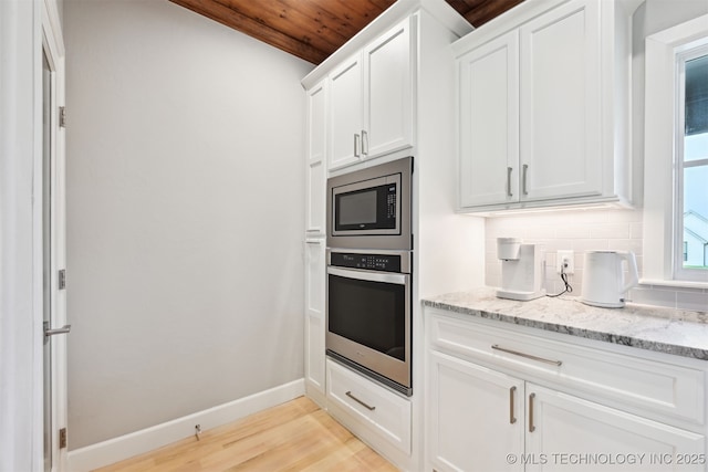 11325 S 212th E Ave, Broken Arrow, OK 74014 - kitchen with stainless steel appliances, decorative backsplash, light wood-style flooring, white cabinetry, and light stone countertops
