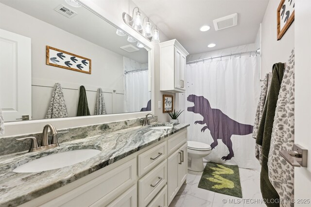 11325 S 212th E Ave, Broken Arrow, OK 74014 - bathroom with marble look tile flooring, double vanity, and recessed lighting