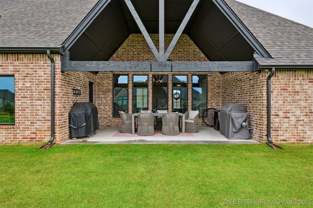 11325 S 212th E Ave, Broken Arrow, OK 74014 - rear view of property featuring brick siding, a patio, and a yard