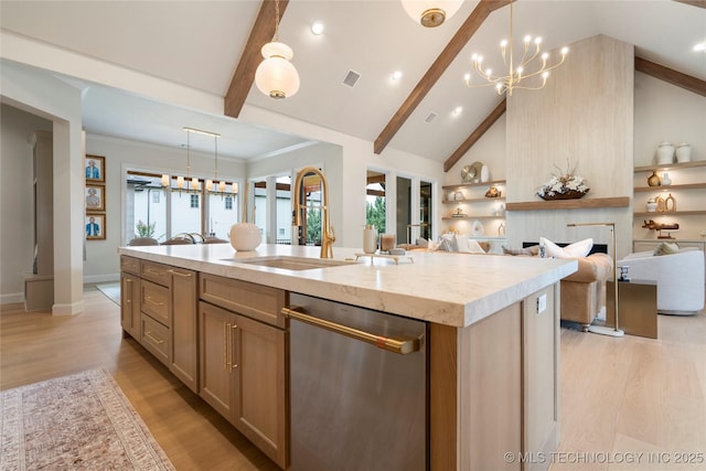 6026 E 119th Pl, Tulsa, OK 74137 - kitchen featuring stainless steel dishwasher, open floor plan, an island with sink, a chandelier, and light wood-style flooring