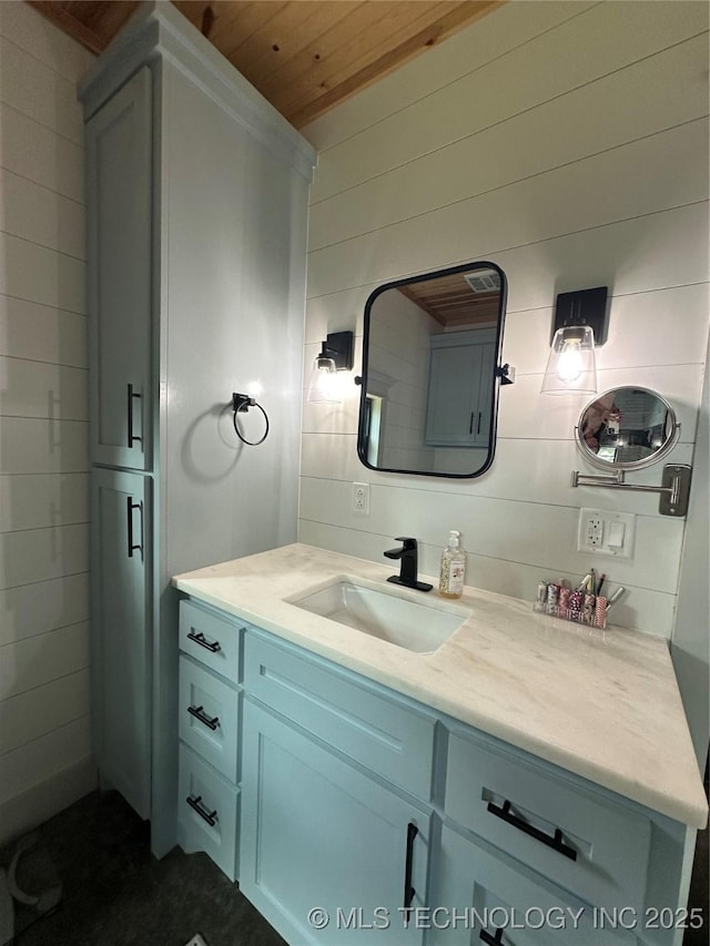 13425 SW 1025th Ave, Tuskahoma, OK 74571 - bathroom featuring vanity, wooden ceiling, and wood walls
