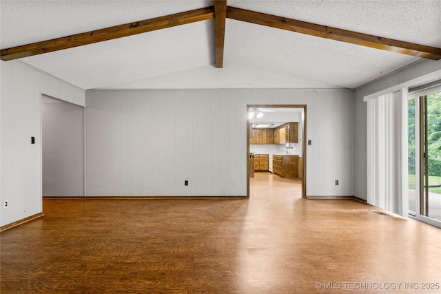 911 N Fir St, Jenks, OK 74037 - unfurnished living room featuring wood finished floors and baseboards