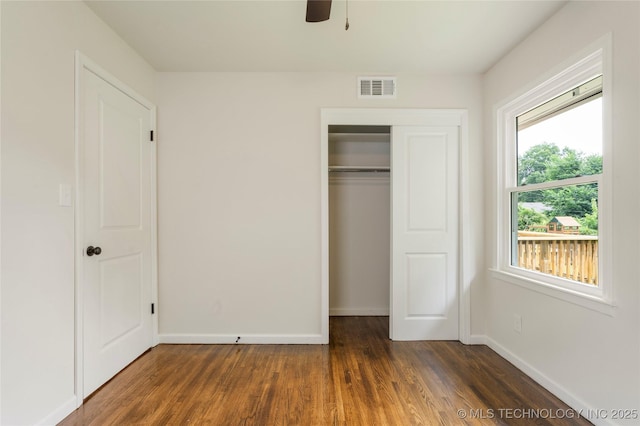 4015 S Urbana Ave, Tulsa, OK 74135 - unfurnished bedroom with dark wood-type flooring, a closet, and ceiling fan