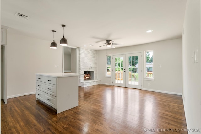4015 S Urbana Ave, Tulsa, OK 74135 - unfurnished living room featuring ceiling fan, dark wood finished floors, recessed lighting, and a fireplace