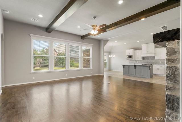 12913 S Ash St, Jenks, OK 74037 - unfurnished living room with a ceiling fan, beam ceiling, light wood-style floors, a chandelier, and recessed lighting
