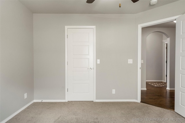 12913 S Ash St, Jenks, OK 74037 - empty room with arched walkways, a ceiling fan, carpet, and a smoke detector