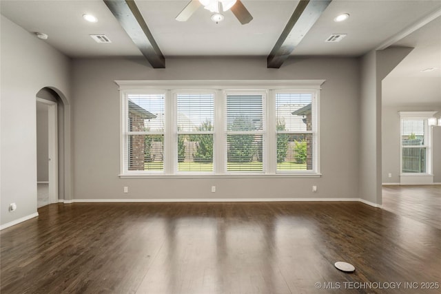 12913 S Ash St, Jenks, OK 74037 - empty room with beam ceiling, a ceiling fan, dark wood finished floors, a smoke detector, and arched walkways